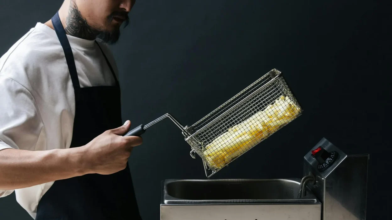 Air fryer and oven side-by-side cooking frozen french fries, showing crispiness comparison.