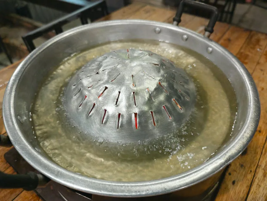 Pot Of Boiling Water Releases Steam On A Gas Stove
