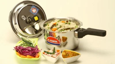 Pressure cooker and slow cooker side by side on a kitchen counter, comparing energy-efficient cooking appliances.
